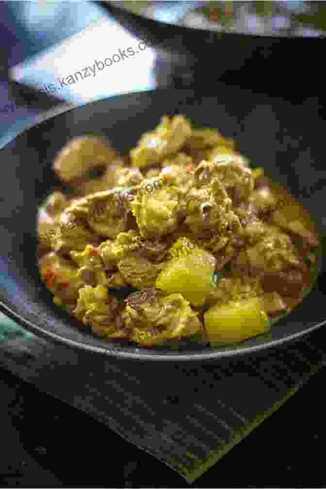 A Tantalizing Indonesian Chicken Curry, Featuring Tender Chicken Cooked In A Thick And Flavorful Rendang Sauce, Garnished With Fresh Cilantro And Crispy Onions Best Recipes Of Cooking Chicken Curry: Chicken Curry Recipes From Different Countries