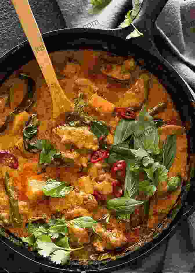 A Vibrant Thai Chicken Curry, Featuring Tender Chicken Cooked In A Rich Coconut Milk And Red Curry Paste Sauce, Garnished With Fresh Basil Leaves Best Recipes Of Cooking Chicken Curry: Chicken Curry Recipes From Different Countries